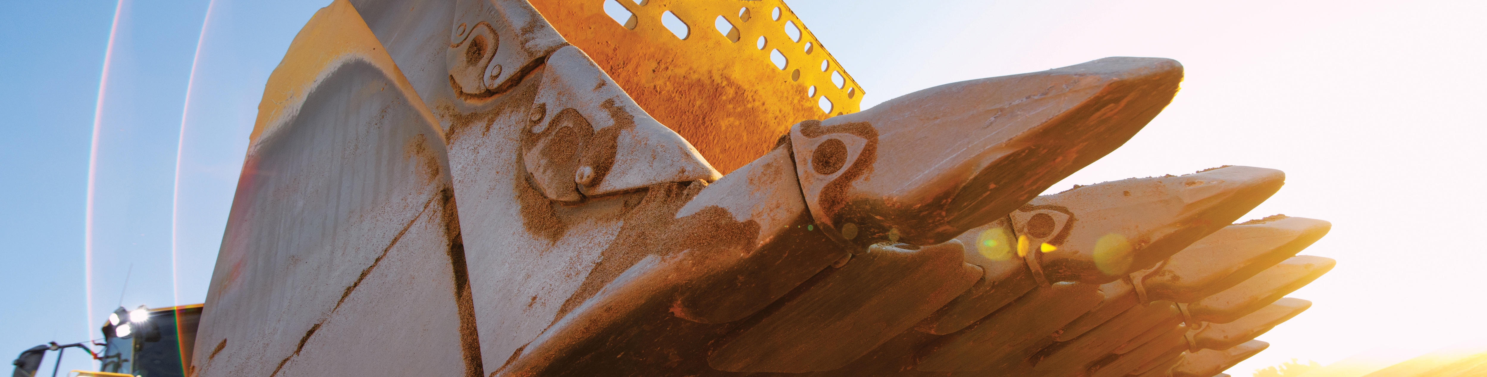 close up of bucket teeth on an excavator bucket